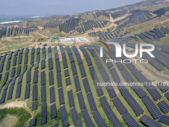 The barren mountains of the past are now filling with solar photovoltaics in Li Mawu Village, Yuncheng City, Shanxi Province, China, on July...