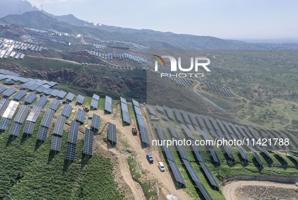 The barren mountains of the past are now filling with solar photovoltaics in Li Mawu Village, Yuncheng City, Shanxi Province, China, on July...