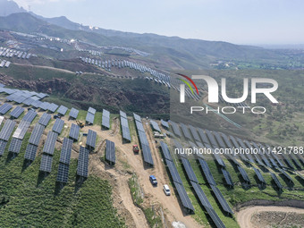 The barren mountains of the past are now filling with solar photovoltaics in Li Mawu Village, Yuncheng City, Shanxi Province, China, on July...