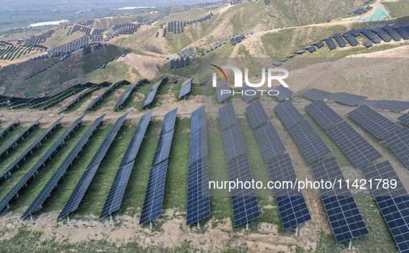 The barren mountains of the past are now filling with solar photovoltaics in Li Mawu Village, Yuncheng City, Shanxi Province, China, on July...