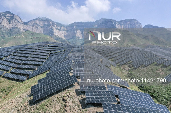 The barren mountains of the past are now filling with solar photovoltaics in Li Mawu Village, Yuncheng City, Shanxi Province, China, on July...