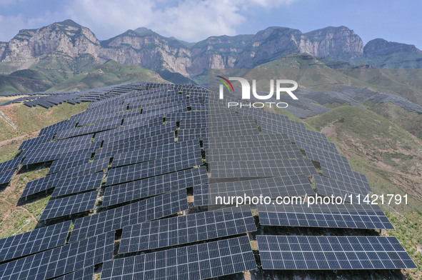 The barren mountains of the past are now filling with solar photovoltaics in Li Mawu Village, Yuncheng City, Shanxi Province, China, on July...