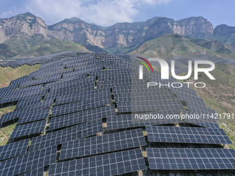 The barren mountains of the past are now filling with solar photovoltaics in Li Mawu Village, Yuncheng City, Shanxi Province, China, on July...