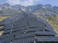 The barren mountains of the past are now filling with solar photovoltaics in Li Mawu Village, Yuncheng City, Shanxi Province, China, on July...