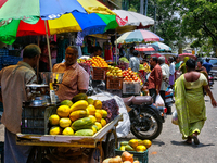 Merchants are selling fruits from small carts along the roadside in the East Fort in Thiruvananthapuram (Trivandrum), Kerala, India, on Apri...