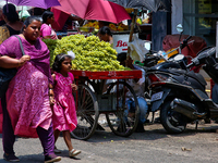 Merchants are selling fruits from small carts along the roadside in the East Fort in Thiruvananthapuram (Trivandrum), Kerala, India, on Apri...