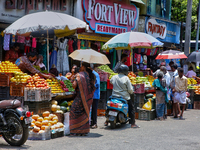 Merchants are selling fruits along the roadside in the East Fort in Thiruvananthapuram (Trivandrum), Kerala, India, on April 13, 2024. (