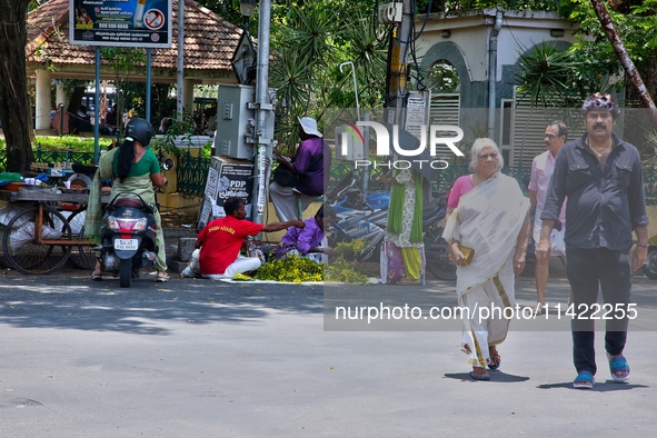 Merchants are selling fruits from small carts along the roadside in the East Fort in Thiruvananthapuram (Trivandrum), Kerala, India, on Apri...