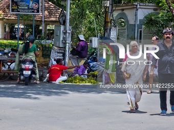 Merchants are selling fruits from small carts along the roadside in the East Fort in Thiruvananthapuram (Trivandrum), Kerala, India, on Apri...