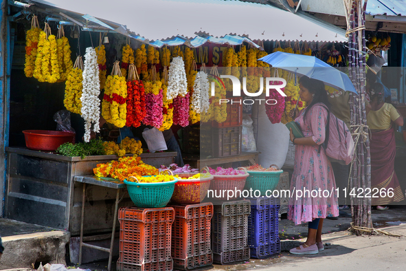 Merchants are selling floral garlands in the East Fort in Thiruvananthapuram (Trivandrum), Kerala, India, on April 13, 2024. 