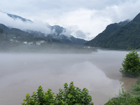 Floodwaters are inundating farmland and trees along the banks of the Tunpu section of Qingjiang River in Enshi, Hubei province, China, on Ju...