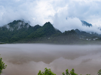 Floodwaters are inundating farmland and trees along the banks of the Tunpu section of Qingjiang River in Enshi, Hubei province, China, on Ju...