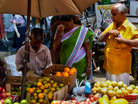 Merchants are selling fruits from small carts along the roadside in the East Fort in Thiruvananthapuram (Trivandrum), Kerala, India, on Apri...