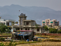 A farm laborer is living in a small makeshift house in Haldwani, Uttarakhand, India, on April 23, 2024. (