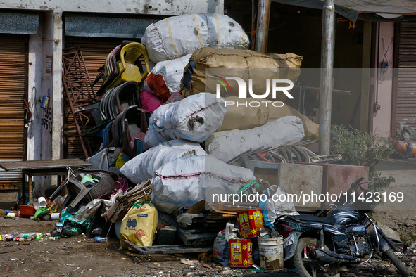 Sacks are being filled with collected scrap items in Haldwani, Uttarakhand, India, on April 23, 2024. 