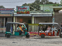 Auto-rickshaws are parking outside shops in Haldwani, Uttarakhand, India, on April 23, 2024. (