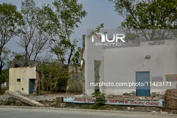 The remains of a building are being destroyed in Haldwani, Uttarakhand, India, on April 23, 2024. 