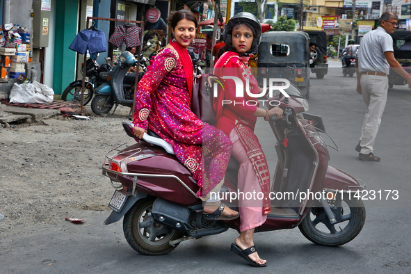 Women are traveling to a wedding party in Haldwani, Uttarakhand, India, on April 23, 2024. 