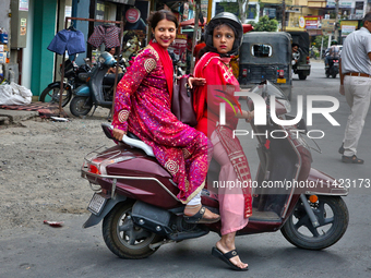 Women are traveling to a wedding party in Haldwani, Uttarakhand, India, on April 23, 2024. (