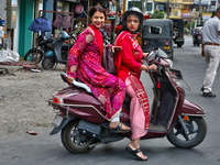 Women are traveling to a wedding party in Haldwani, Uttarakhand, India, on April 23, 2024. (