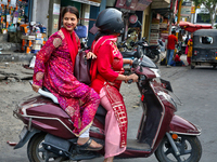 Women are traveling to a wedding party in Haldwani, Uttarakhand, India, on April 23, 2024. (