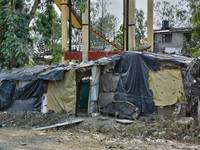 A poor family is building a house along the roadside from scrap items in Haldwani, Uttarakhand, India, on April 23, 2024. (