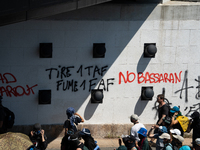 Protesters are walking among the houses of a village during a demonstration against the construction of a giant water reservoir (mega-bassin...