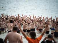 Demonstrators are celebrating their mobilization by swimming in the ocean during a demonstration against the construction of giant water res...