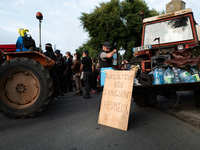 Demonstrators are sitting in front of the Atlantic port of La Rochelle in western France, on July 20, 2024, during a demonstration against t...