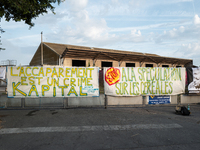 Demonstrators are sitting in front of the Atlantic port of La Rochelle in western France, on July 20, 2024, during a demonstration against t...