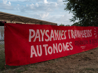 Demonstrators are sitting in front of the Atlantic port of La Rochelle in western France, on July 20, 2024, during a demonstration against t...