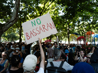 Protesters are holding a pan card saying ''No Bassaran'' during a demonstration against the construction of a giant water reservoir (mega-ba...