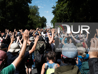 Protesters are walking among a park during a demonstration against the construction of a giant water reservoir (mega-bassine) in La Rochelle...