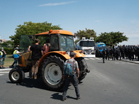 A tractor is near the police during a demonstration against the construction of a giant water reservoir (mega-bassine) in La Rochelle, Franc...