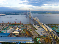 The photo is showing the Chang-Tai Yangtze River Bridge under construction in Taixing, Jiangsu province, China, on July 21, 2024. (