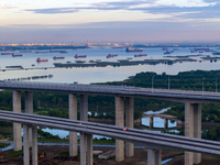 The photo is showing the Chang-Tai Yangtze River Bridge under construction in Taixing, Jiangsu province, China, on July 21, 2024. (