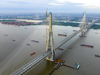 The photo is showing the Chang-Tai Yangtze River Bridge under construction in Taixing, Jiangsu province, China, on July 21, 2024. (