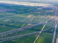 The photo is showing the Chang-Tai Yangtze River Bridge under construction in Taixing, Jiangsu province, China, on July 21, 2024. (