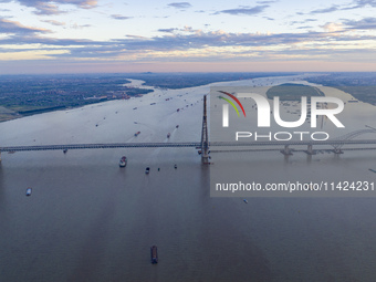 The photo is showing the Chang-Tai Yangtze River Bridge under construction in Taixing, Jiangsu province, China, on July 21, 2024. (