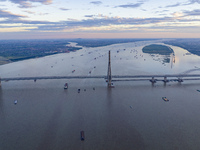 The photo is showing the Chang-Tai Yangtze River Bridge under construction in Taixing, Jiangsu province, China, on July 21, 2024. (