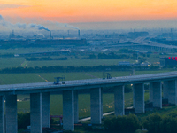 The photo is showing the Chang-Tai Yangtze River Bridge under construction in Taixing, Jiangsu province, China, on July 21, 2024. (