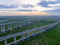 The photo is showing the Chang-Tai Yangtze River Bridge under construction in Taixing, Jiangsu province, China, on July 21, 2024. (