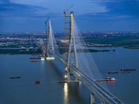 The photo is showing the Chang-Tai Yangtze River Bridge under construction in Taixing, Jiangsu province, China, on July 21, 2024. (