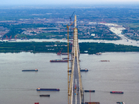 The photo is showing the Chang-Tai Yangtze River Bridge under construction in Taixing, Jiangsu province, China, on July 21, 2024. (