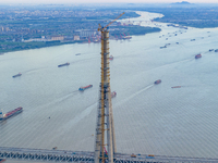 The photo is showing the Chang-Tai Yangtze River Bridge under construction in Taixing, Jiangsu province, China, on July 21, 2024. (