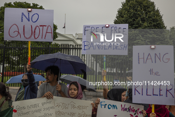 Demonstrators of the Bangladeshi community are displaying signs with the words ''No Quota, Free Free Bangladesh, Hang the Killer'' among oth...