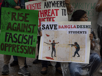 Demonstrators of the Bangladeshi community are displaying signs with the words ''Rise Against Fascism & Oppression, Save Bangladeshi Student...