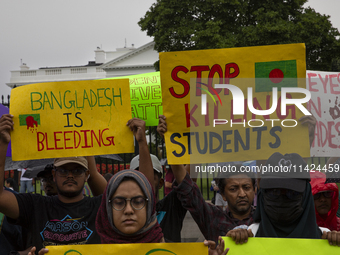 Demonstrators of the Bangladeshi community are displaying signs with the words ''Bangladesh is Bleeding, Stop Killing Students'' among other...