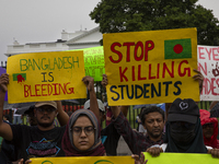 Demonstrators of the Bangladeshi community are displaying signs with the words ''Bangladesh is Bleeding, Stop Killing Students'' among other...