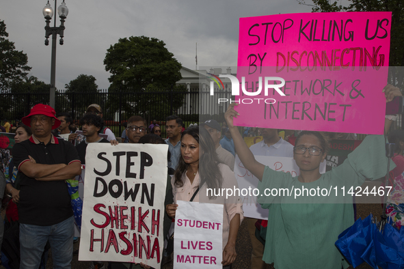 A demonstrator of the Bangladeshi community is holding a sign with the words ''Stop killing us by disconnecting the network & internet'' dur...